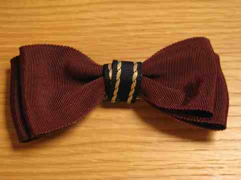 chocolate brown with braided navy bow tie
